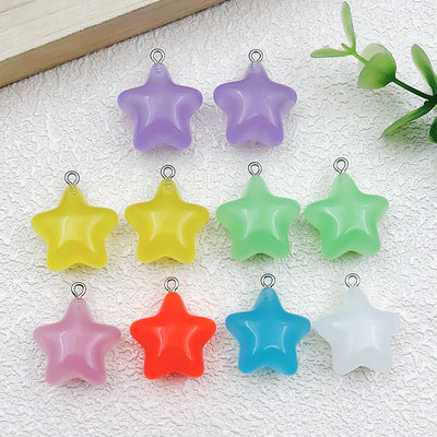 Colorful star charms arranged on a light background