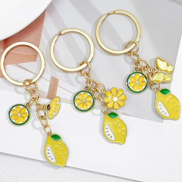 Gold-Tone Enamel Lemon Keychain With Citrus Slice Flower And Butterfly Charms