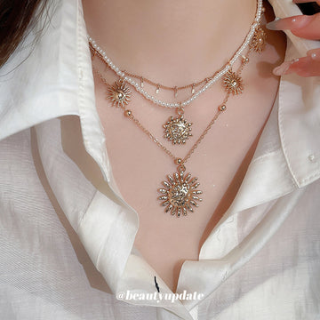 Layered Gold Sun Pendant Pearl Multi Strand Necklace