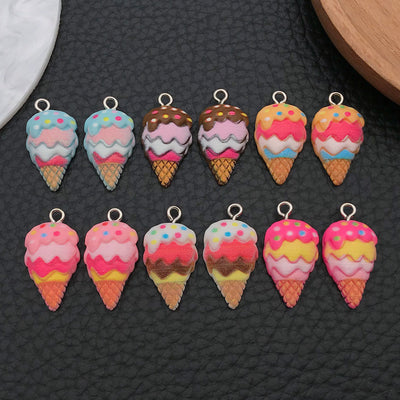 Multicolor ice cream charms arranged on a light background