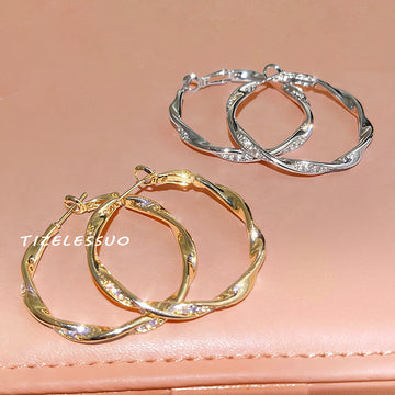 Irregular Twisted Large Hoop Earrings In Gold And Silver Tone