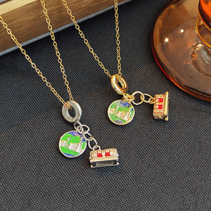 Red Tram and Globe Travel Charm Necklace in Two Metal Tones