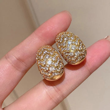 Oval Pave Scrollwork Clip-On Earrings In Gold And Silver Tones