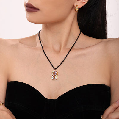 Model wearing black bead gold flower zircon pendant necklace