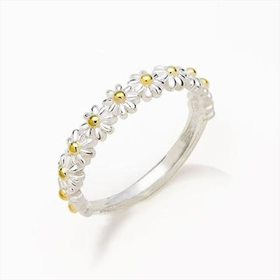 Product view showing silver-tone daisy flower half-eternity ring