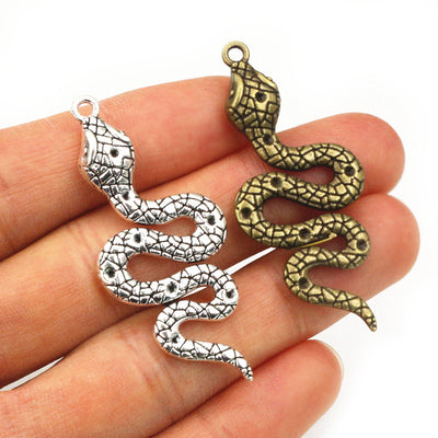 Grouped front view of textured snake metal charms in four size and finish options