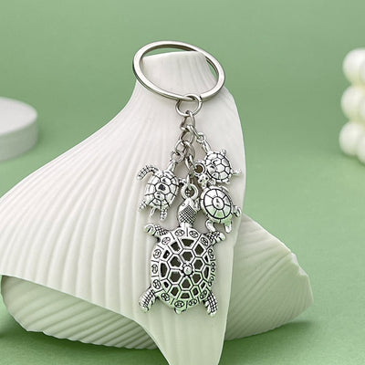 Image 1 showing a turtle keychain.