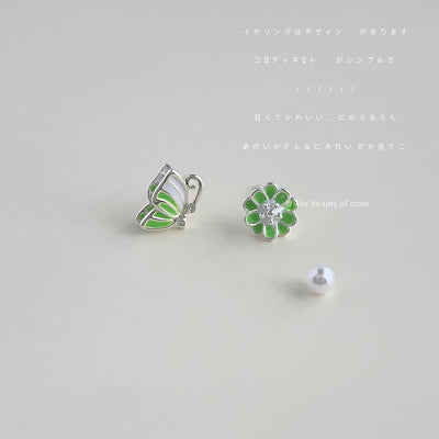 Green butterfly and flower mismatched silver studs on gray