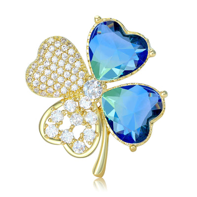 Blue AB gem four-leaf clover brooch close-up on white