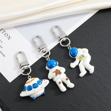 Astronaut and UFO Clip Keychains in Three Space Designs