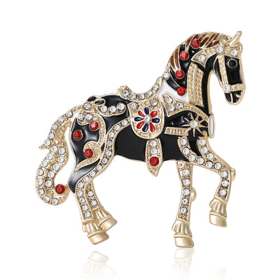 Red Horse, Black Horse, Brown Horse, White Horse brooch styles arranged on a light display