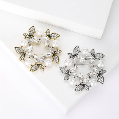 Front view showing the floral wreath brooch with faux pearls and crystal leaves