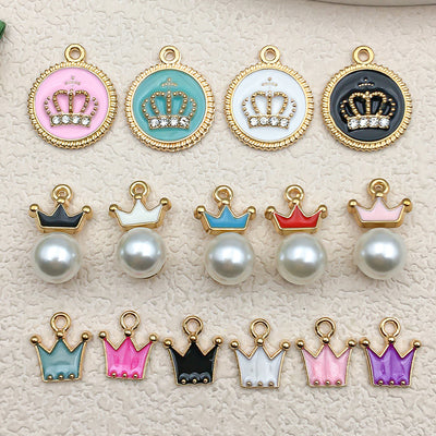 Colorful crown charms arranged on a light background