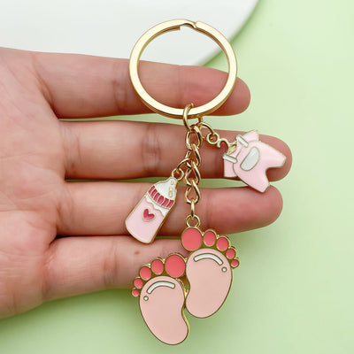 Image 1 showing a person holding up a pink keychain.