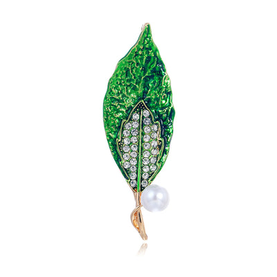 Front product view of an emerald leaf brooch