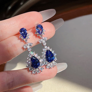 Deep Blue Oval And Pear Floral Halo Long Earrings In Silver Tone