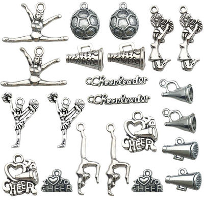 Antique silver assorted shape charms arranged on a light background