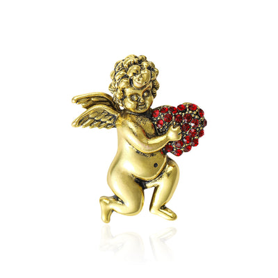 Gold cherub angel brooch holding red rhinestone heart front white