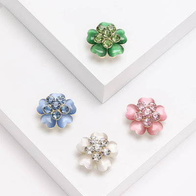 Front view of a layered five-petal flower with a faceted crystal cluster
