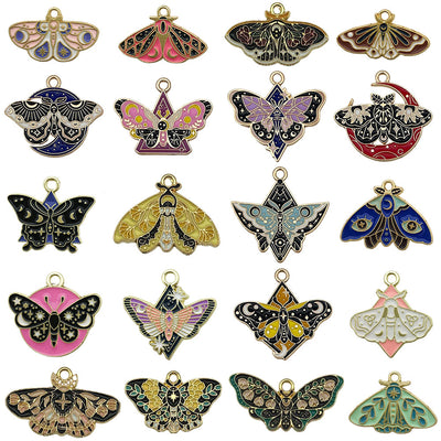 Gold-tone butterfly charms arranged on a light background