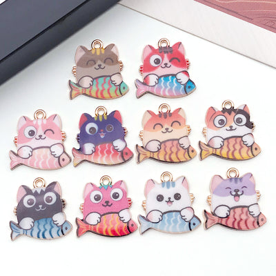 Colorful cat charms arranged on a light background