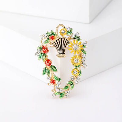 Front view of the colorful flower basket brooch with crystal accents on a white background