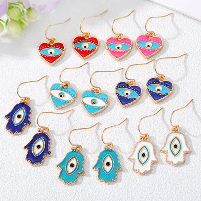 Main product view of gold Tone Enamel Heart and Hamsa Evil Eye Hook Earrings