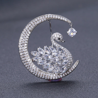 Clear rhinestone crescent moon swan brooch front view