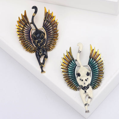 Front view showing the gold tone winged cat brooch with black or white enamel body