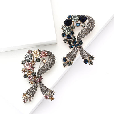 Front view of a dark crystal bow decorated with small multicolor flower stones