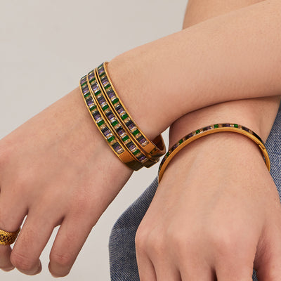 Gold multicolor baguette zircon clasp bangles stacked on wrists