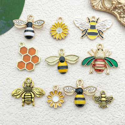 Colorful bee charms arranged on a light background