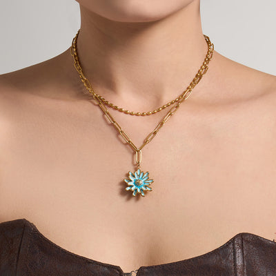Neckline view of double layer enamel daisy pendant necklaces in main image 1.