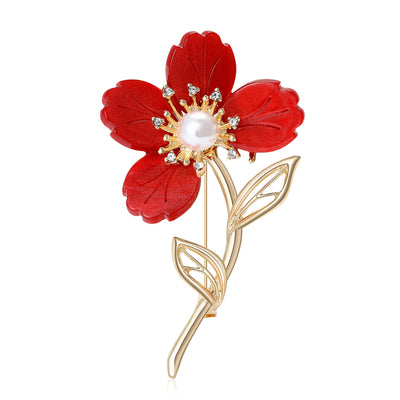 Front view of the four petal flower brooch in four colorways with polished metal detail on a white background
