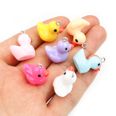 Duck charms arranged assortment on a white background