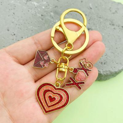 Image 1 showing a person holding up some charms.
