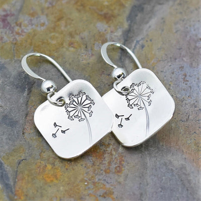 Square dandelion engraved drop earrings on slate stone