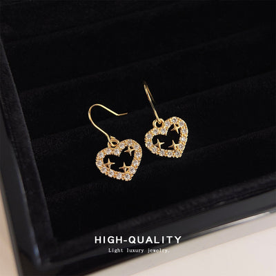Gold crystal pave open heart star hooks in black velvet tray