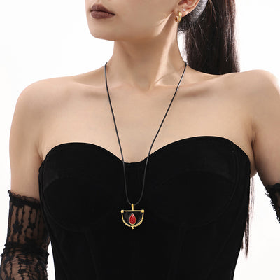 Gold frame half moon enamel red teardrop pendant on black cord on model
