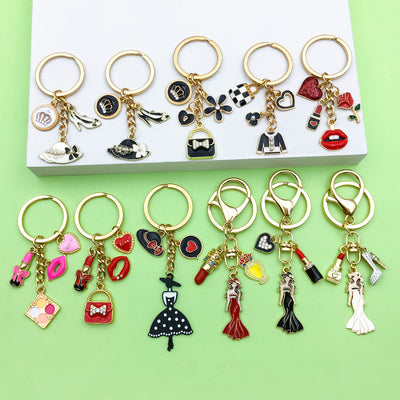 Image 1 showing a box of ass key chains with various charms.