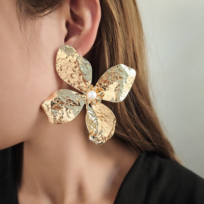 Primary supplied view of hammered flower statement earrings