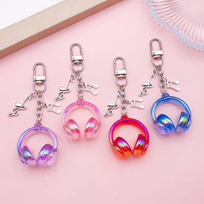 Image 1 showing a set of four key chains with charms.