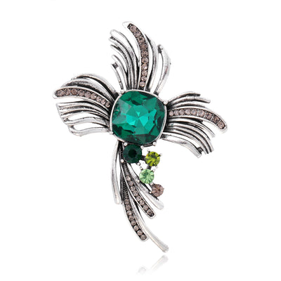 Front product view of the green and white diamond brooch