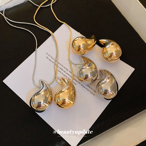 Polished Flame Drop Necklace And Earrings In Gold Tone Or Silver Tone