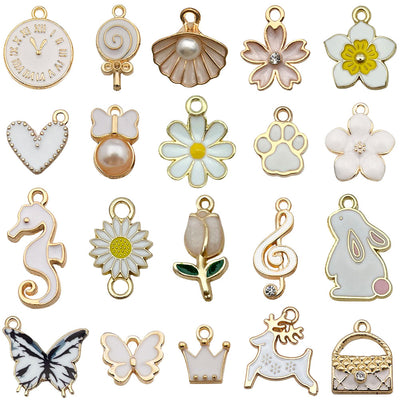 Colorful shell and heart charms arranged on a light background