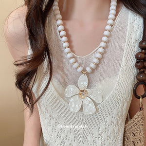 White Beaded Necklace With Large Five Petal Flower Pendant