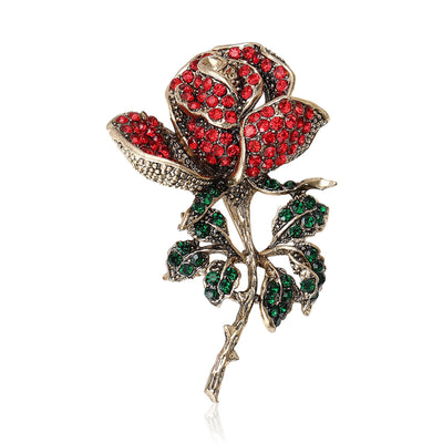 Front view of a long-stemmed rose covered with red or purple and green crystals