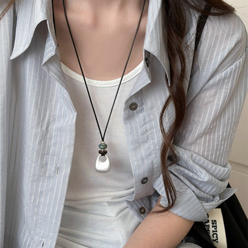 Black Cord Necklace with Silver Tone Sculptural Pendant