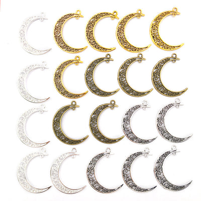 Gold-tone moon charms arranged on a light background