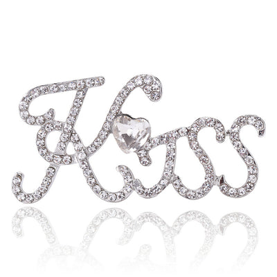 Silver crystal Kiss script brooch with heart center